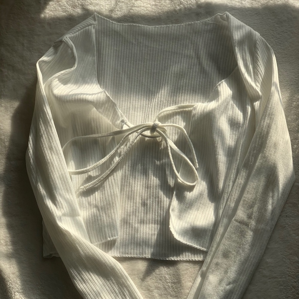 white tie-up top or cropped cardigan